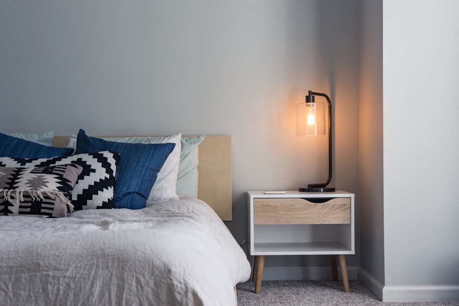 Bedroom with layered lighting including pendant lights and warm-toned table lamps