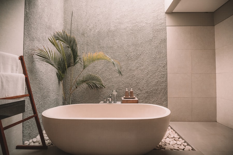 Brushed gold rainfall showerhead and matching fixtures in a marble-clad shower