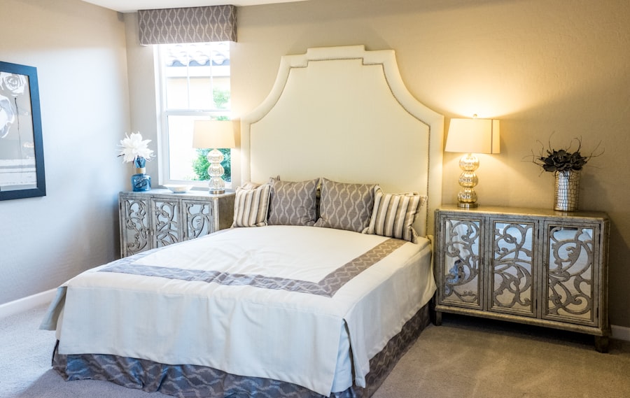 Master bedroom with deep navy accent wall and warm gold accessories