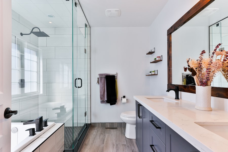 Small bathroom with floating vanity, wall-mounted toilet, and large mirror